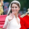 Princess Catherine and Prince William wave from a carriage on their wedding day