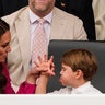 Princess Catherine corrects Prince Louis as he gestures at her in the stands