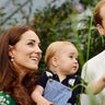 Princess Catherine, Prince William and son, George in a garden