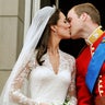 Prince William and Kate kiss on the balcony after their wedding