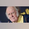 M. Emmet Walsh wears yellow striped shirt at film premiere in Hollywood.