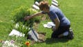 Grieving woman at a grave site