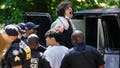 A protester yells as he gets loaded into a police van after being arrested during an anti-Israel protest against the war in Gaza at Emory University on April 25, 2024 in Atlanta, Georgia, amid the Israel-Hamas war.