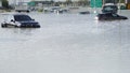 Vehicles sit abandoned in floodwater covering a major road in Dubai, United Arab Emirates, Wednesday, April 17, 2024. Heavy thunderstorms lashed the United Arab Emirates on Tuesday, dumping over a year and a halfs worth of rain on the desert city-state of Dubai in the span of hours as it flooded out portions of major highways and its international airport.
