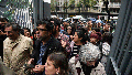 State employees enter their workplace after they were temporarily prevented from entering their workplace due to an anti-government protest in support of workers who were laid off as part of state economic downsizing measures, in Buenos Aires, Argentina, Wednesday, April 3, 2024. According to the State Workers Association, more than 11 thousand dismissals of state employees have been carried out by Javier Milei&rsquo;s government.