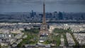Stands are under construction on the Champ-de-Mars with the Eiffel Tower, Monday, April 15, 2024 in Paris. The Champ-de-Mars will host the Beach Volleyball and Blind Football at the Paris 2024 Olympic and Paralympic Games. Le Defense business district is seen in background.