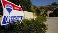 RE/MAX Holdings Inc. signage is displayed outside of an open house in Redondo Beach, California, U.S., on Saturday, Feb. 14, 2015. The National Association of Realtors is scheduled to release existing home sales figures on Feb. 23. Photographer: Patrick T. Fallon/Bloomberg via Getty Images