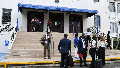 Lawyers and court workers leave the Supreme Court during a recess for the trial of the "Panama Papers" money laundering case in Panama City, Monday, April 8, 2024.
