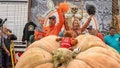 Travis Gienger of Minnesota celebrates his world-record 2,749-pound pumpkin in October 2023 with daughter, Lily, and wife Megan. The pumpkin world championships is held each year in Half Moon Bay, California.