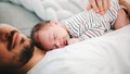Father and baby son sleeping