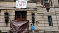 A Columbia student looks at damage to windows of a door at Hamilton Hall at Columbia University on April 30, 2024 in New York City. - Fox News