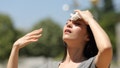 Asian woman drying sweat in a warm summer day