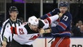Kurtis MacDermid #23 of the New Jersey Devils fights with Matt Rempe #73 of the New York Rangers during the first period at Madison Square Garden on April 03, 2024 in New York City.