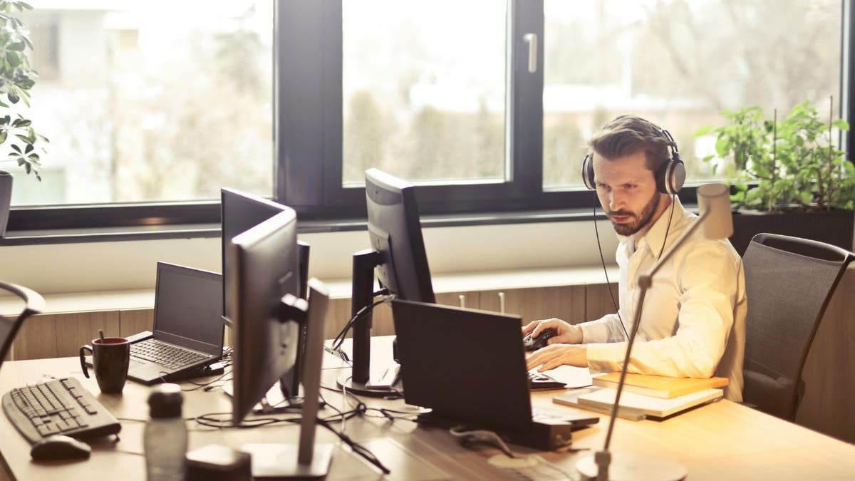 man on a computer