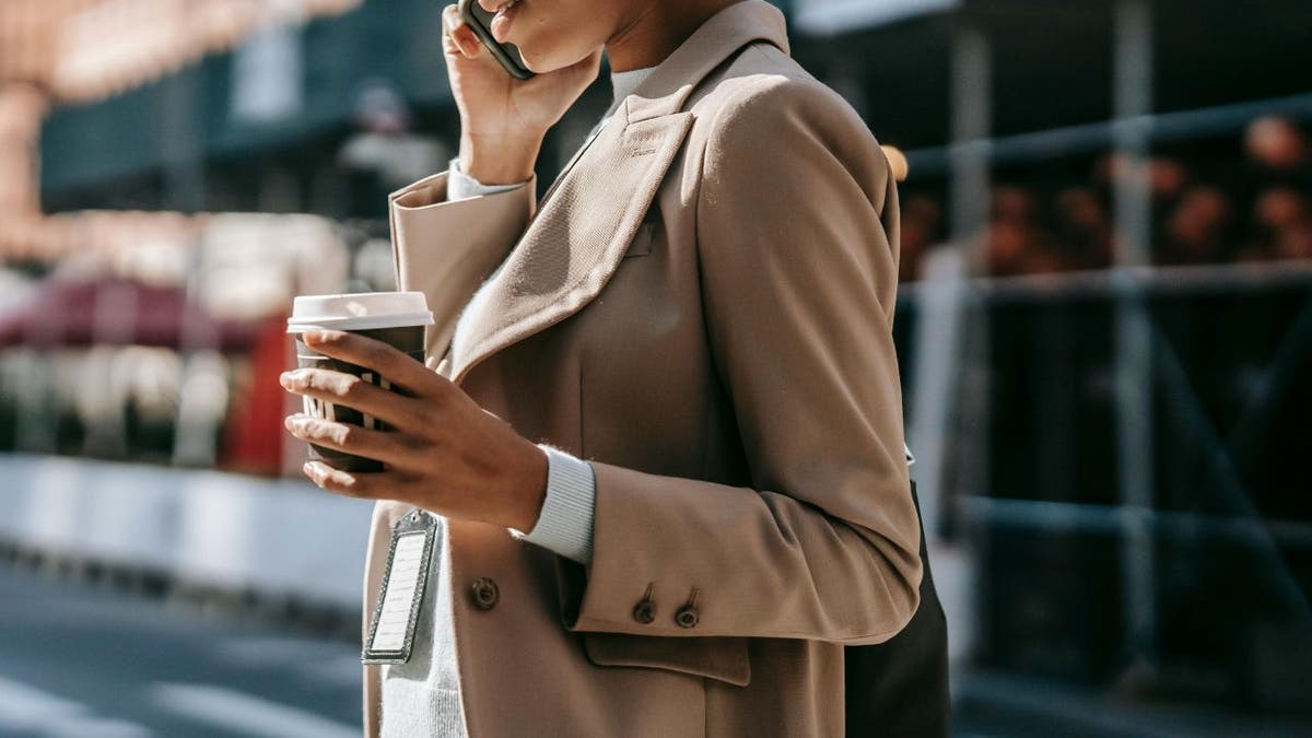 WOMAN talks on phone