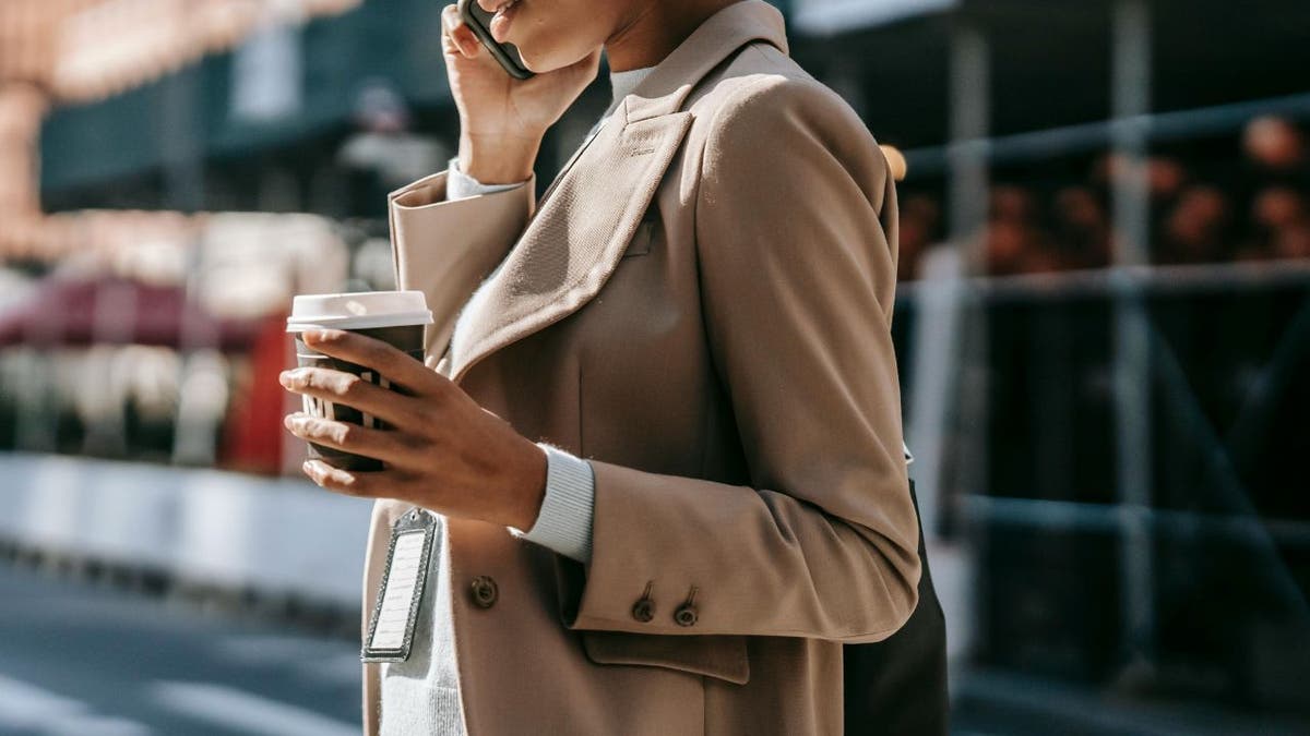 WOMAN talks on phone 