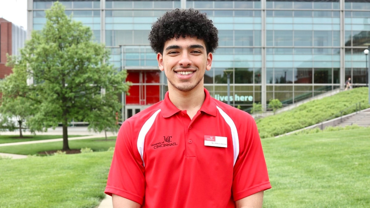 Benjamin Addison wearing a UC shirt