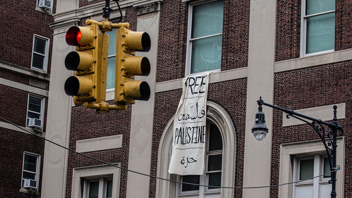 A sign hangs from Hamilton Hall at Columbia University