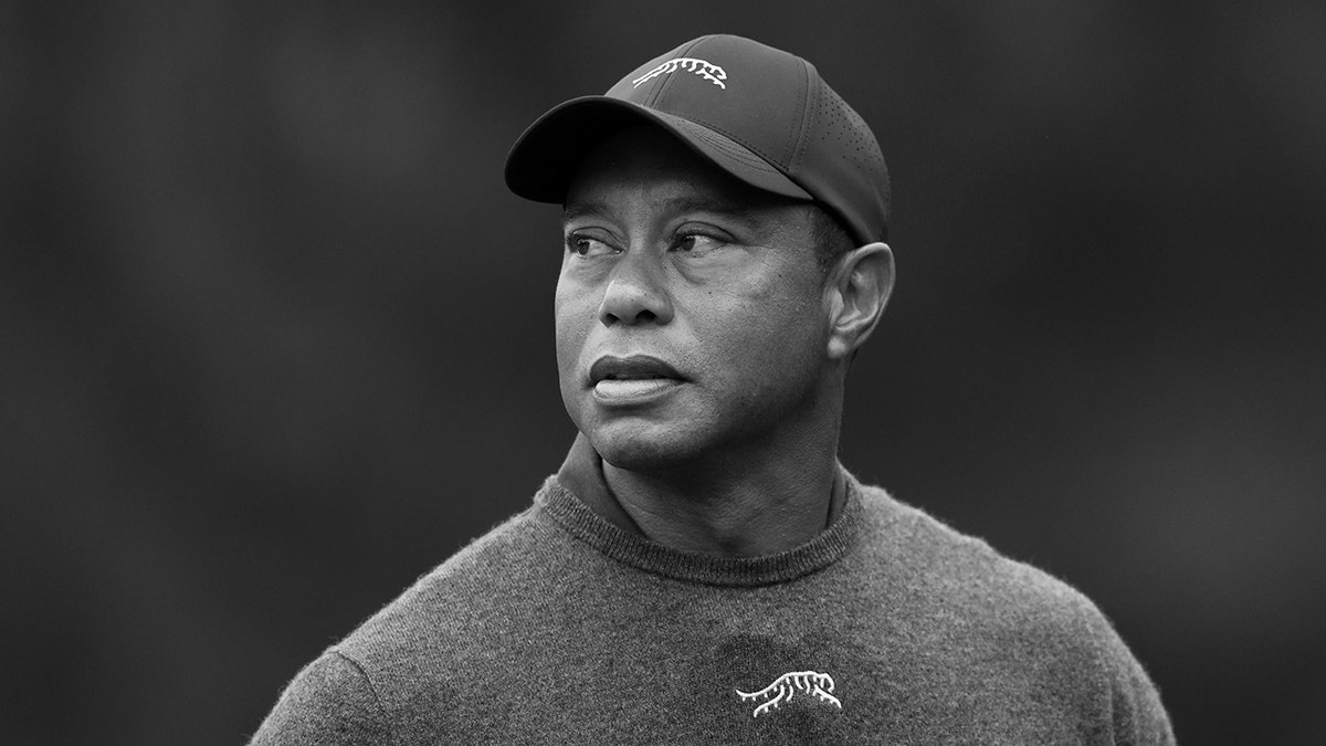 Tiger Woods looks on Augusta National course in black and white