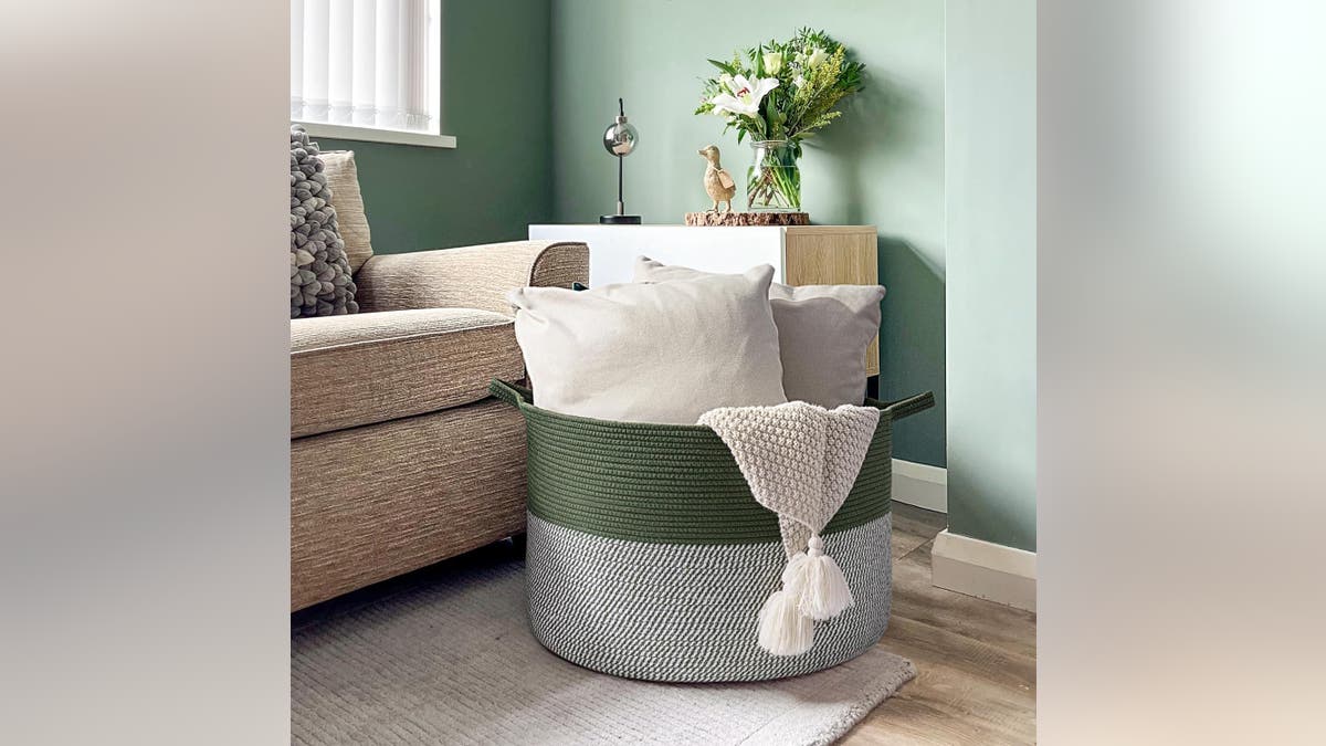 Keep blankets and pillows in this oversized basket. 