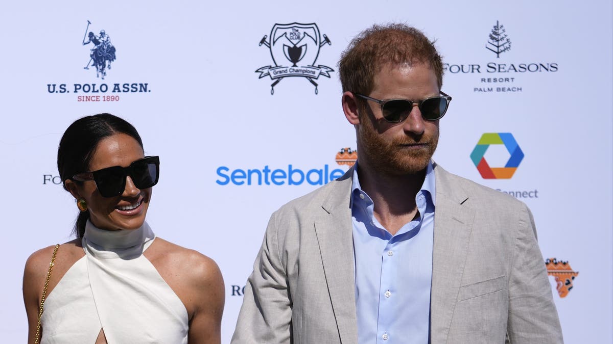 Meghan Markle and Prince Harry wearing sunglasses