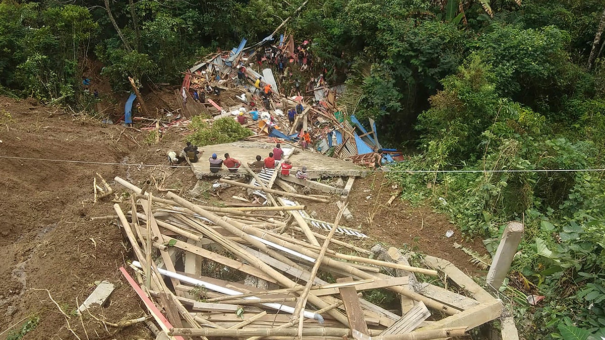 Wood, remains of homes after the landslide