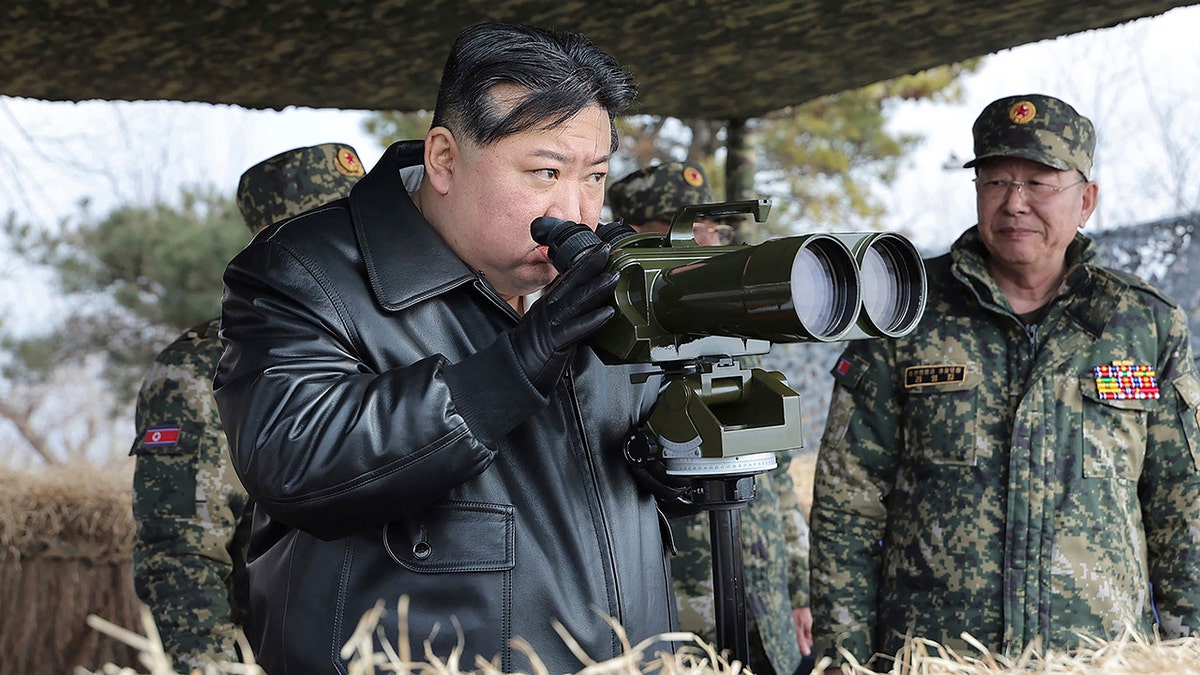 Kim Jong Un with binoculars