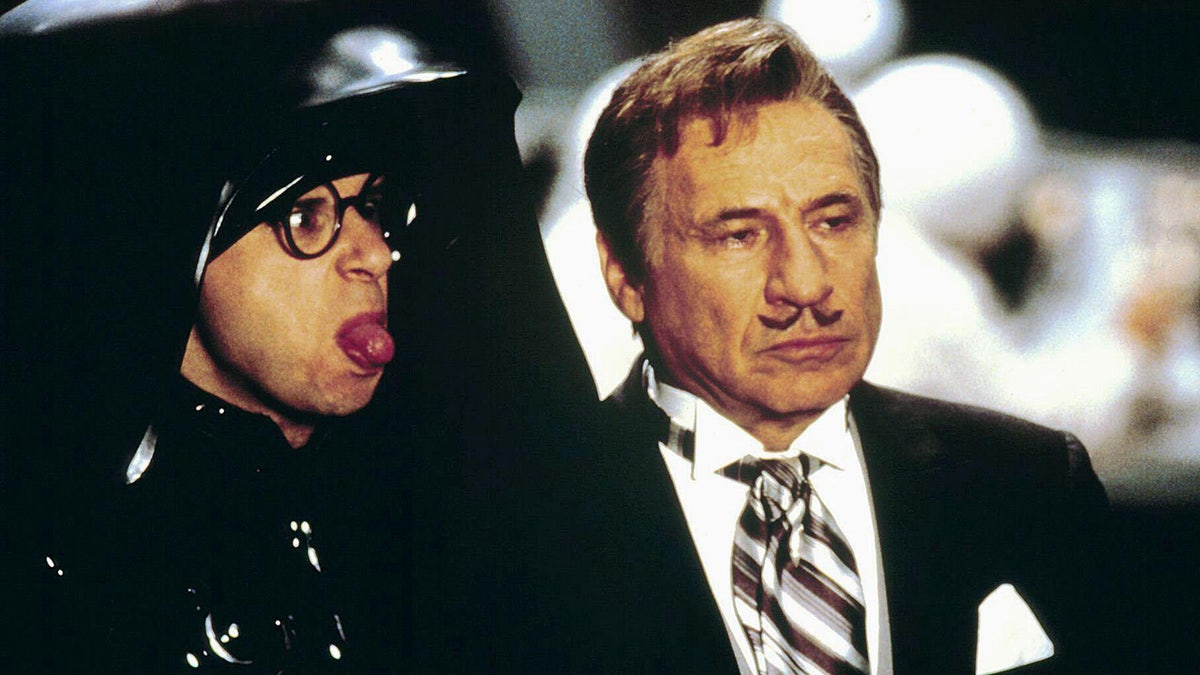 Rick Moranis sticking his tongue out next to Mel Brooks