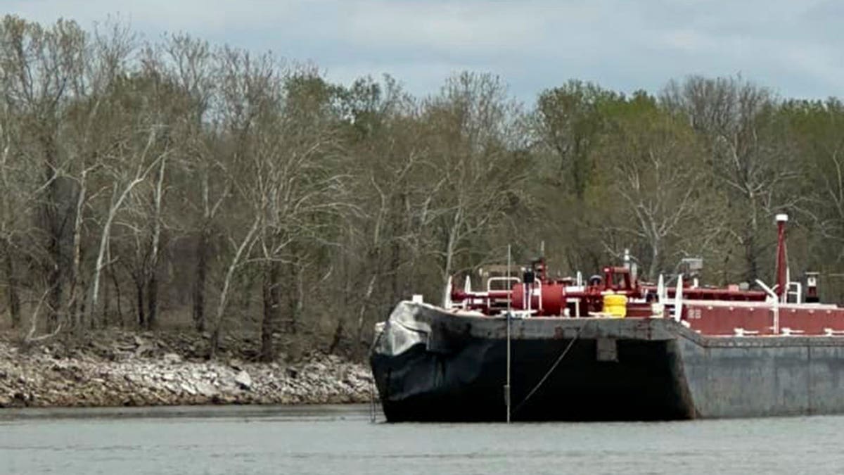 Damage is seen on a barge after it struck a bridge on the Arkansas River