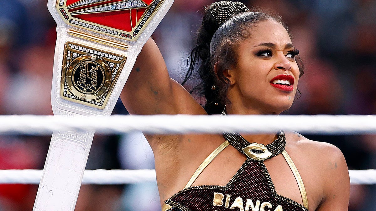 Bianca Belair with the title
