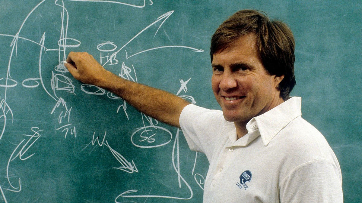 Bill Belichick points to the chalkboard
