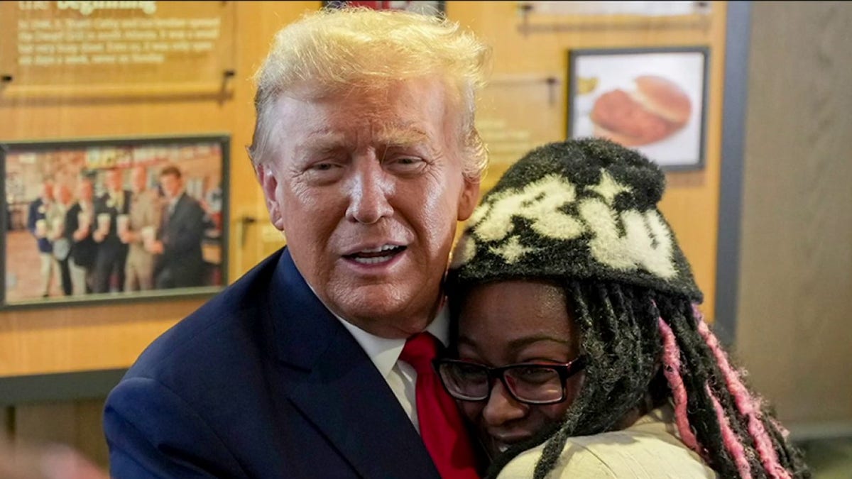 Trump hugs supporter at Atlanta Chick-fil-A