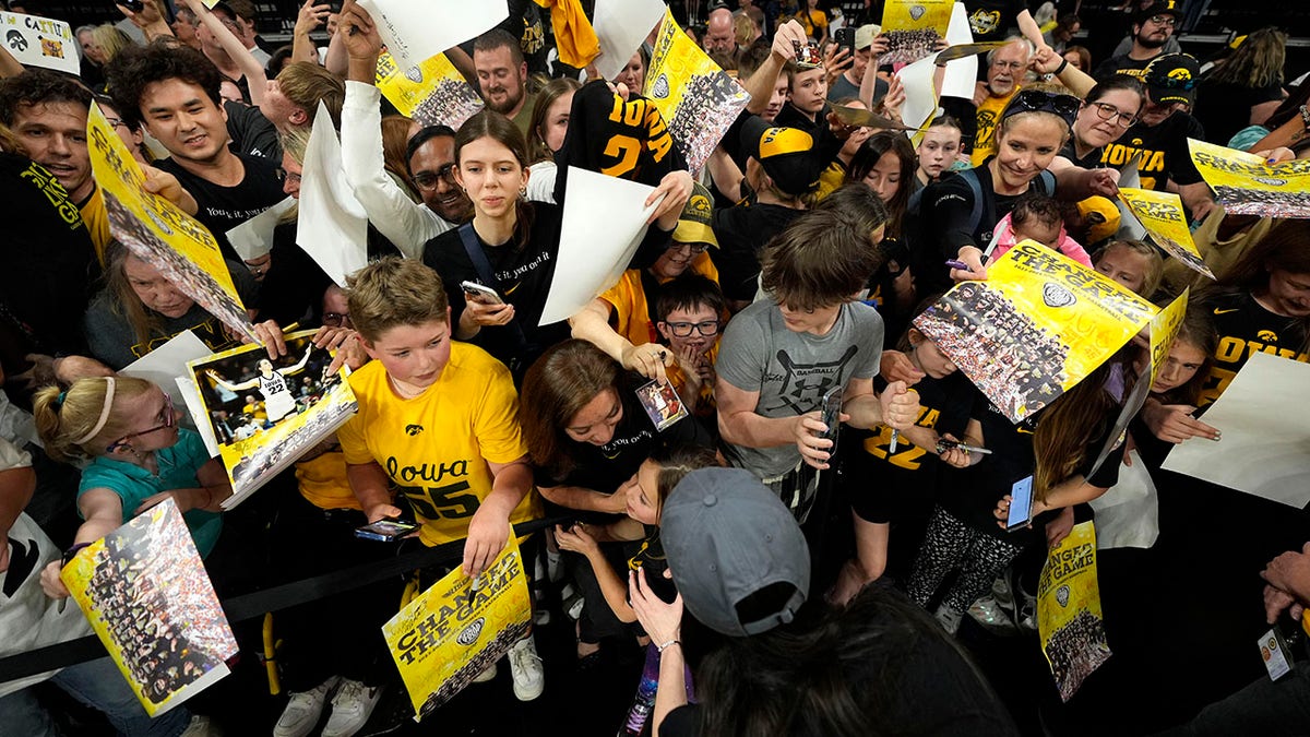 Caitlin Clark signs autographs