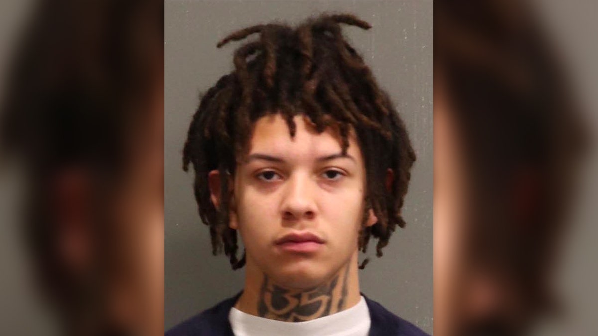 Cameron has dreadlocks and a neck tattoo in his mugshot