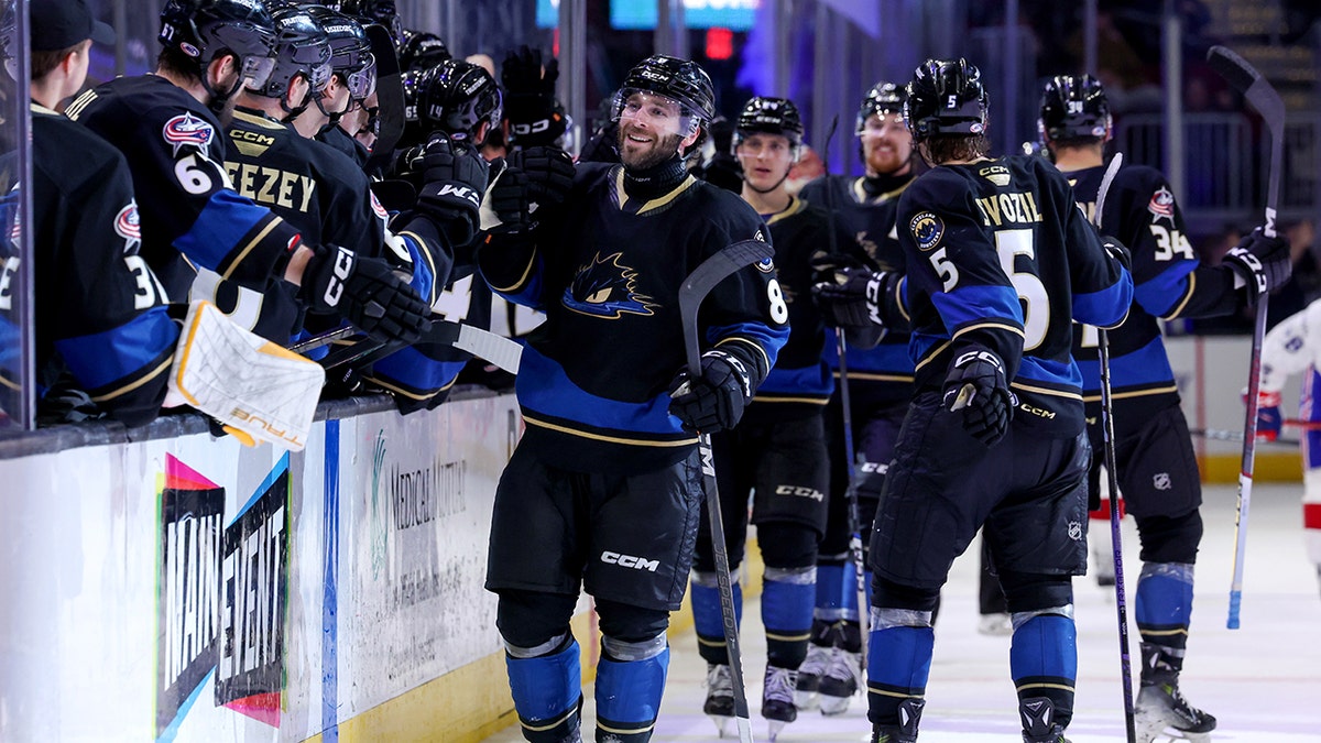 Cleveland Monsters players celebrate goal