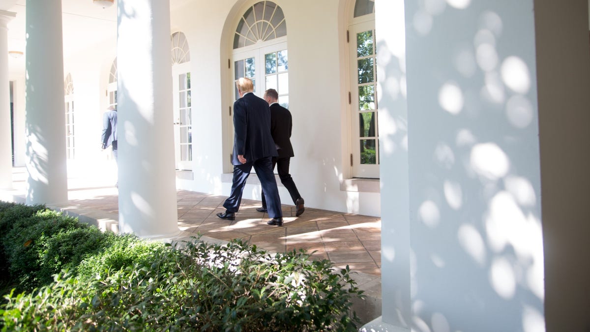 Former Special Assistant to the President and Deputy Director of National Intelligence for Strategy & Communications Cliff Sims walks with President Donald J. Trump down the west colonnade of the White House (Official White House Photo By Shealah Craighead)