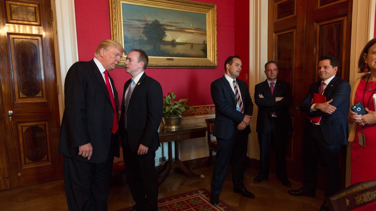 Former Special Assistant to the President and Deputy Director of National Intelligence for Strategy & Communications Cliff Sims speaks with President Donald J. Trump in the Red Room of the White House (Official White House Photo By Shealah Craighead)