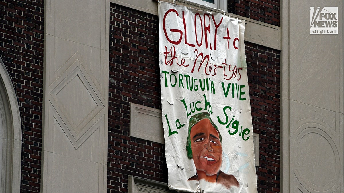 signs hung at Columbia University by anti-Israel protesters