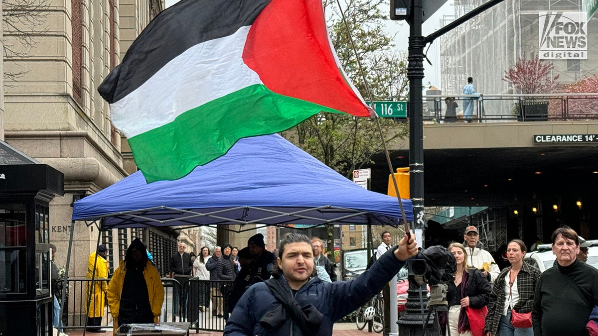 Protester with Palestinian flag 