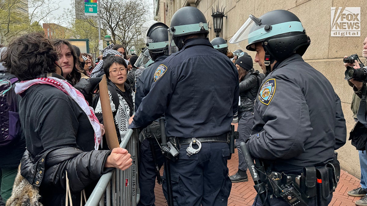 NYPD officers patrol arsenic  pro-Palestine protestors show  extracurricular  of Columbia University’s campus