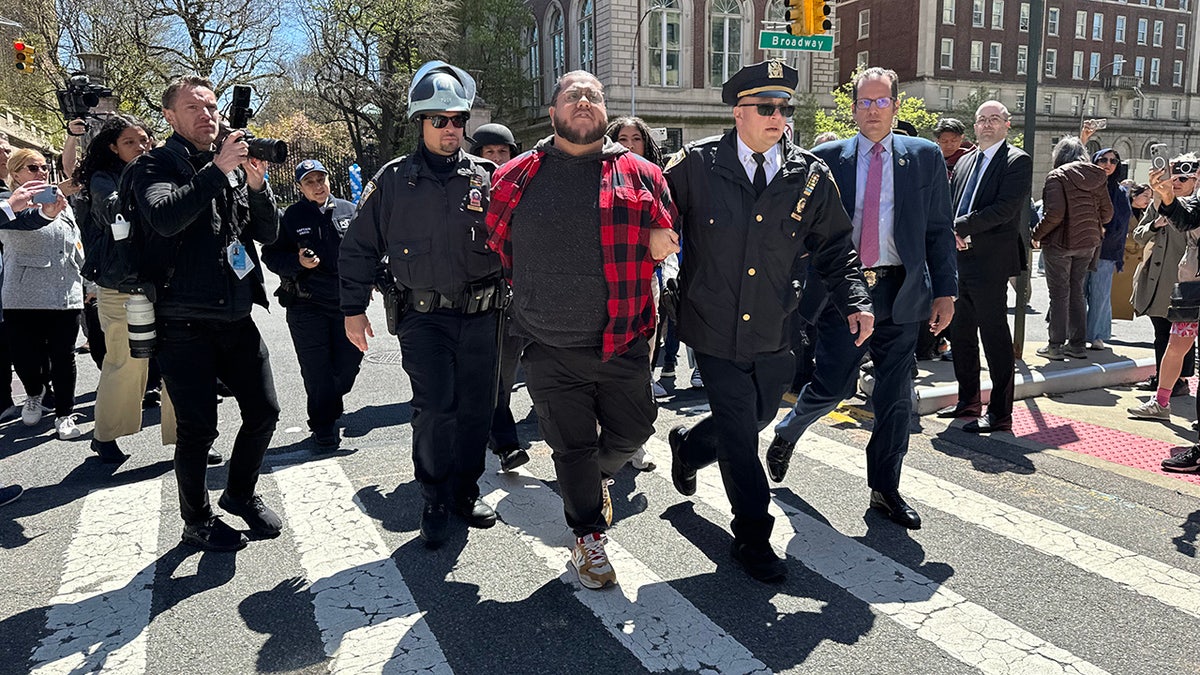 An individual is arrested during a pro-Palestine protest outside of Columbia University in New York City