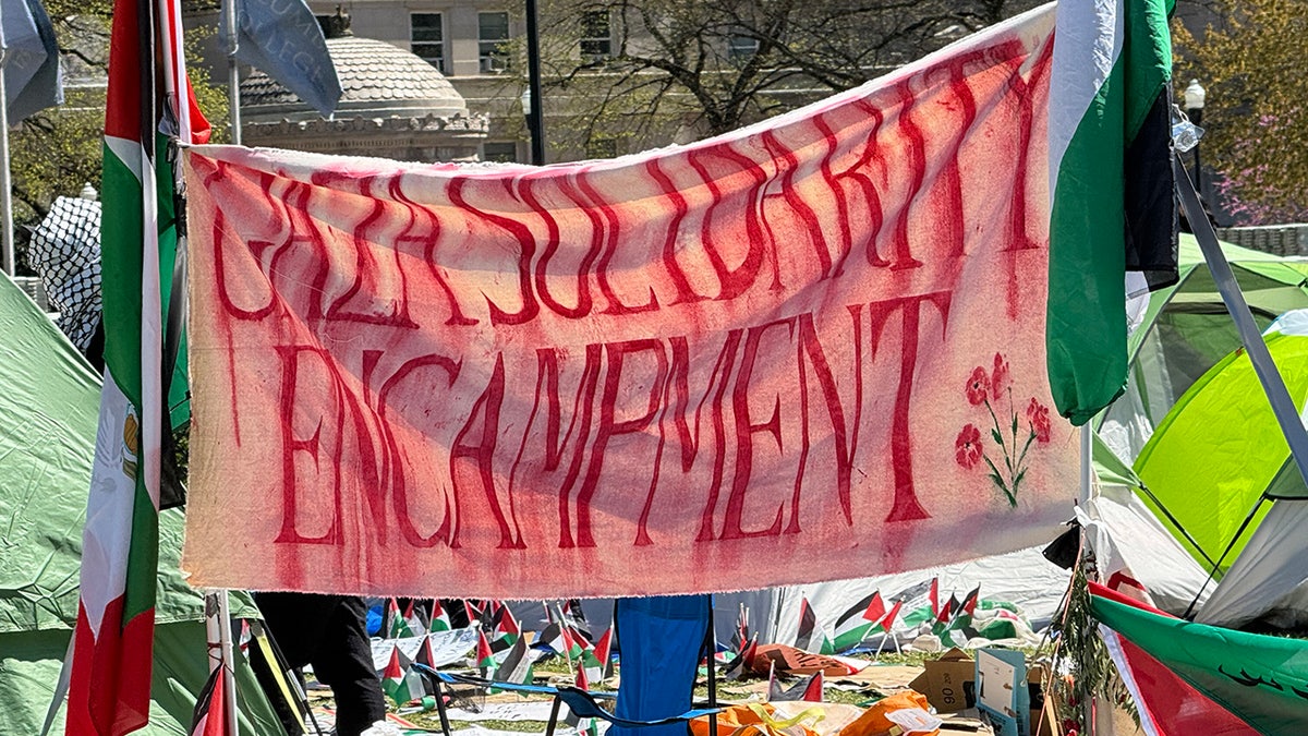 sign reading "Gaza solidarity encampment" on Columbia University grounds