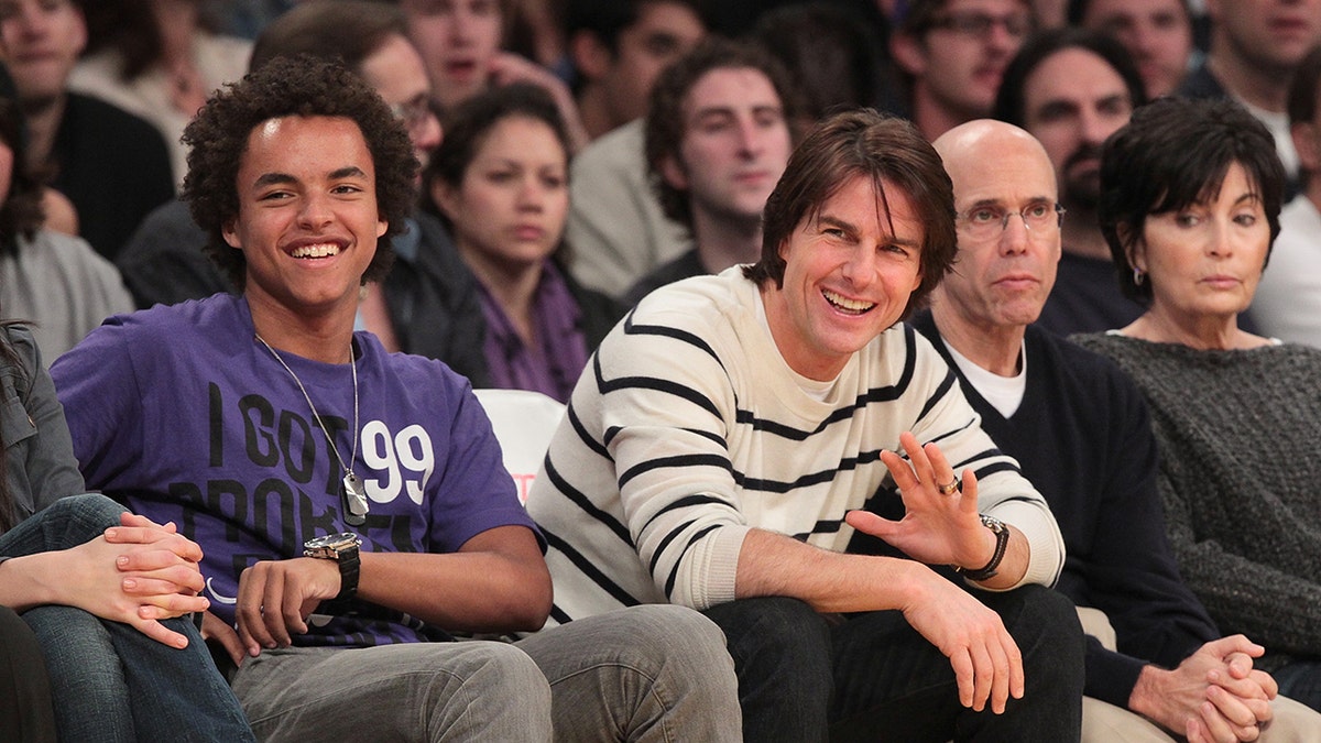 Connor Cruise and Tom Cruise sitting courtside astatine a Lakers game