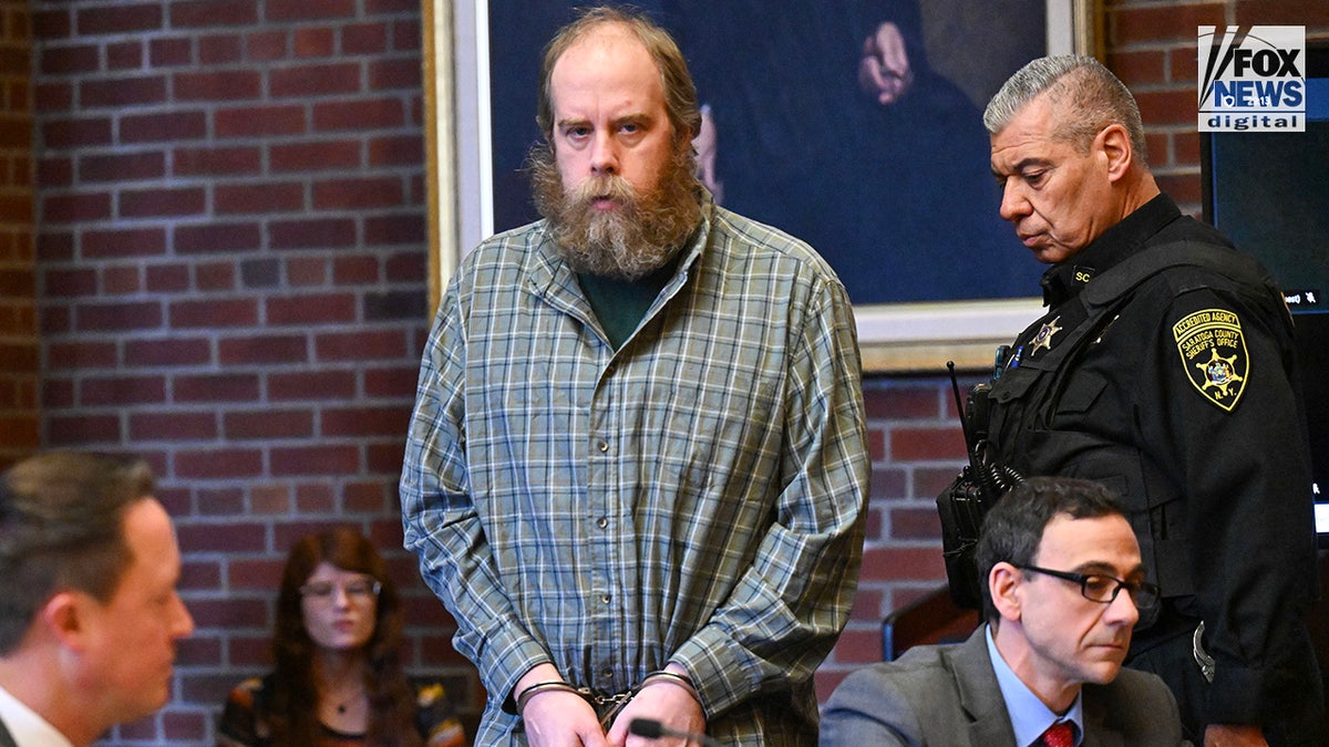 Craig Nelson Ross Jr. stands in court during his sentencing.