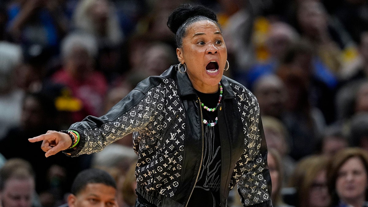 Dawn Staley points and reacts