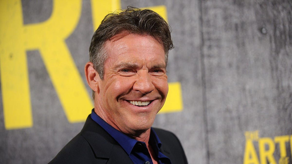 Close up on Dennis Quaid smiling