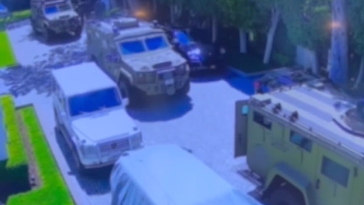 Armored vehicles approach Diddy's mansion with tactical officers inside