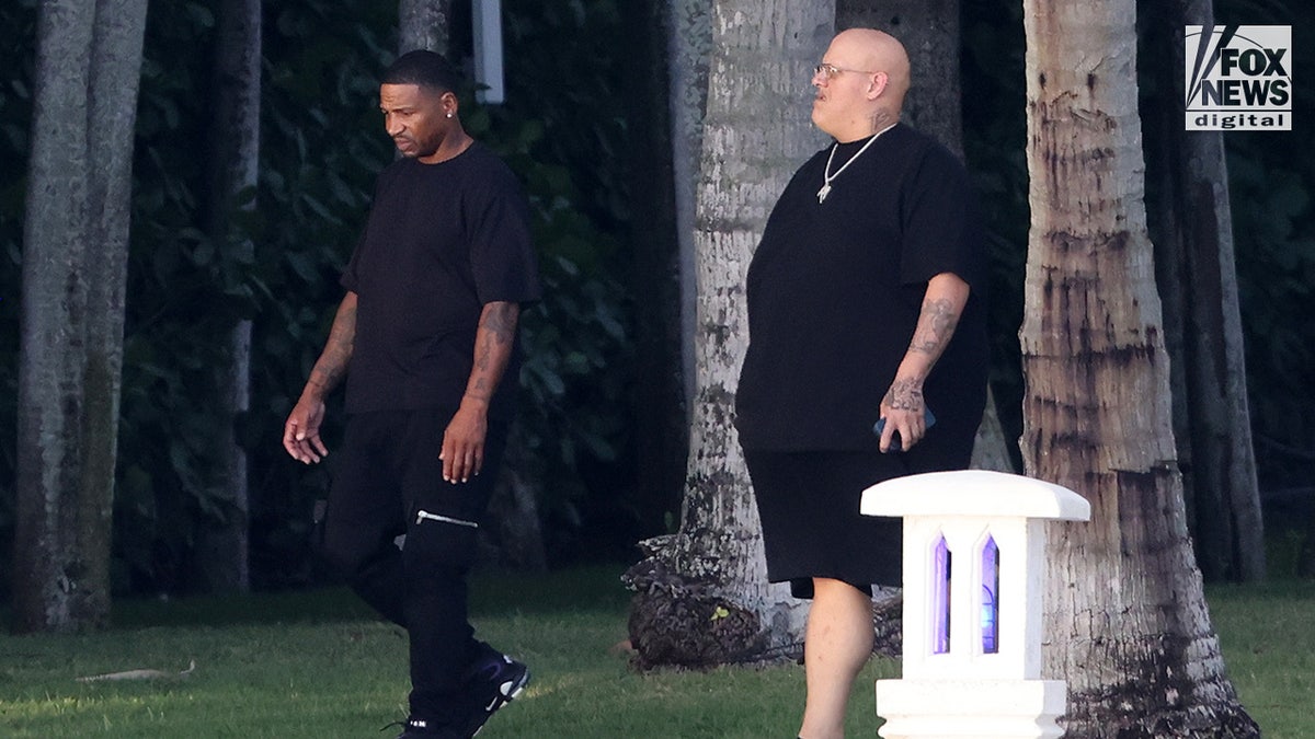 Stevie J and a guest are seen walking outside of rapper Diddy’s home in Miami, Florida