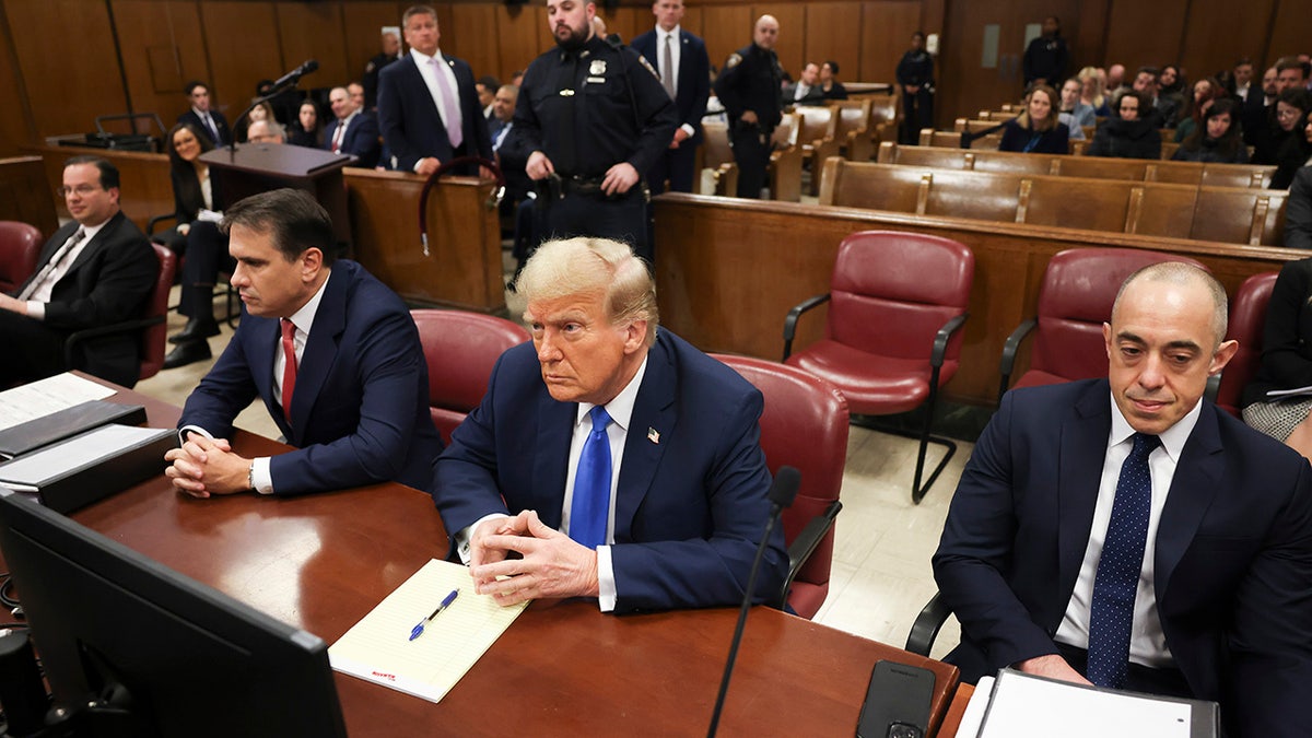 Donald Trump sits successful nan courtroom for nan first time of opening arguments successful his Manhattan criminal trial.