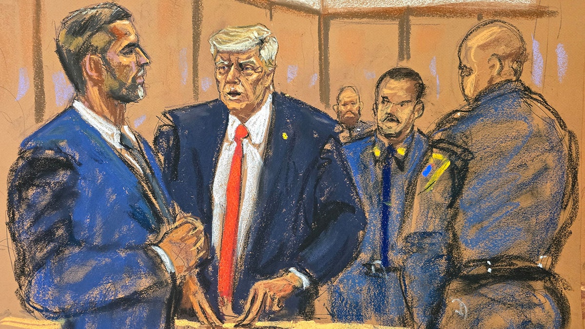 Former U.S. President Donald Trump chats with his lad   Eric Trump during his transgression  trial